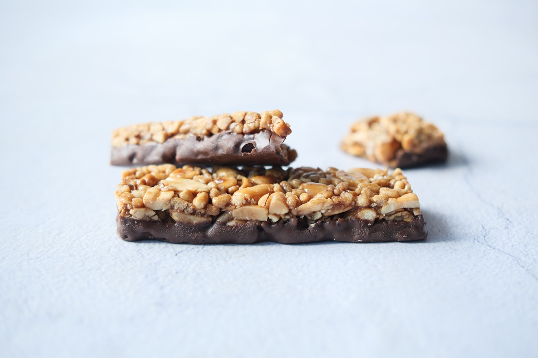 protein almond chocolate sweet bar on white ,